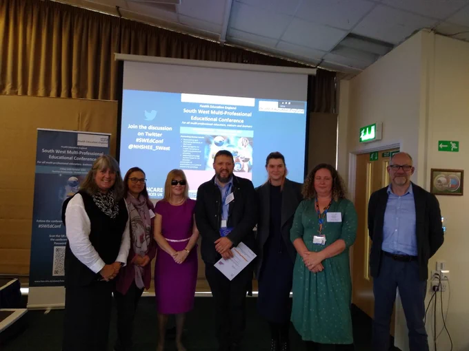 Photos of the poster competition winners at the end of the south west Multi-professional Education Conference 