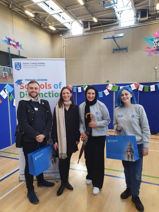 Colaiste Bride staff with TCD gift bag and umbrella in company with female TAP ambassadors and former students!