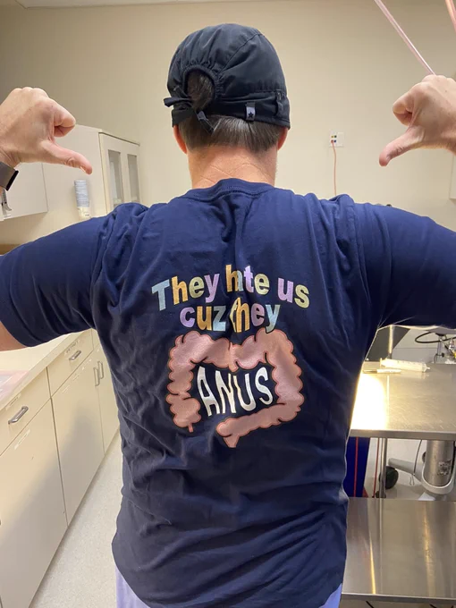 Total stud wearing a shirt with a drawing of colon on it that says”they hate us cuz they anus”