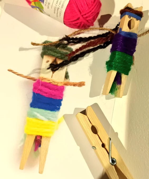 wooden prgs, coloured wools and little peg people