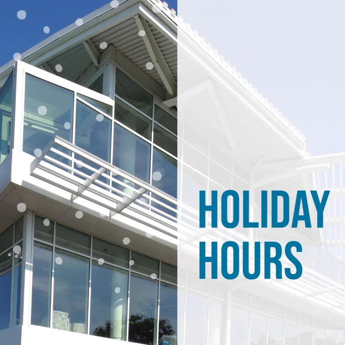 A photo of the library with the words "Holiday Hours"