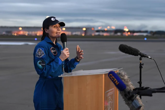 Samantha addresses the gathered press, friends and family after arriving in Cologne