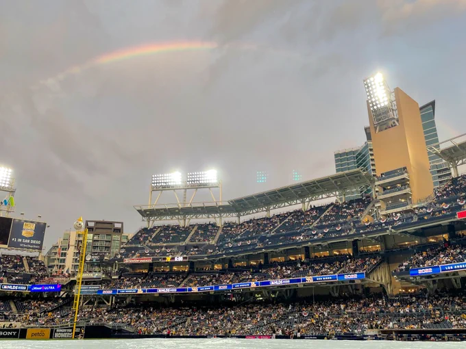 Rainbow is over Petco Park during a rain delay