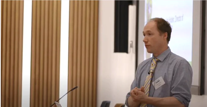 Prof Joe Holden, director of iCASP on stage presenting