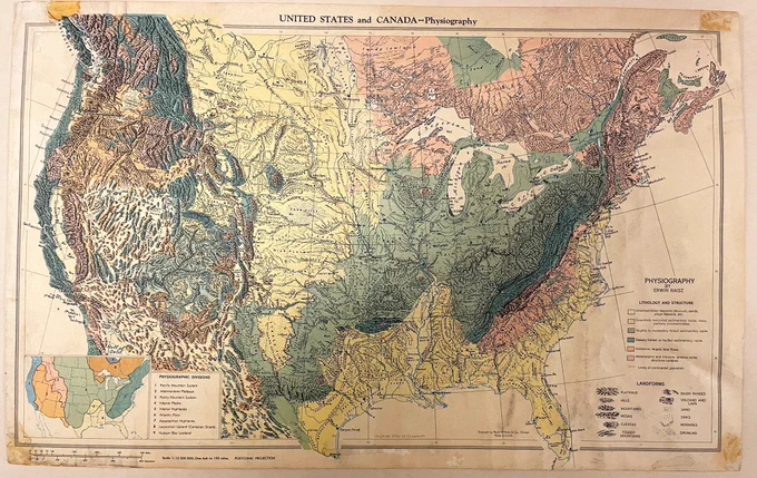 Map of the United States and lower Canada with colors showing the major rock types, with green and yellow sharing the inner continent and pictorial representations of plateaus, hills, mountains, mesas, cuestas, folded mountains, basin ridges, volcano, sand, sinks, moraines, and drumlins