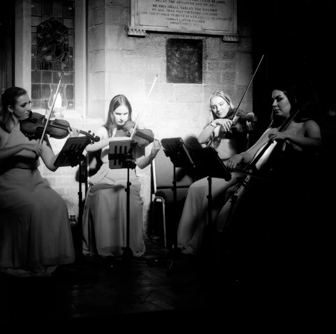 Black and white photo of the Saturday quartet.
