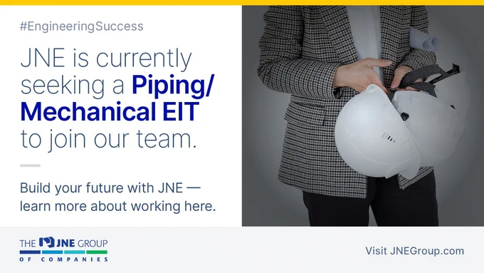 Female engineer holding several hardhats.