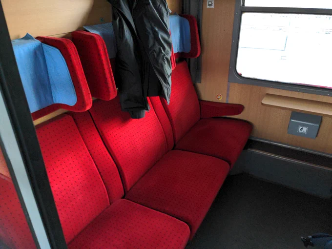3 red seats in the first class in a 6 Seat department.