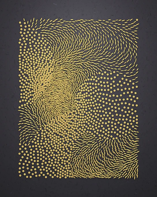 Flat-lay of orzo and stelline pasta shapes arranged in a swirly pattern on a black background