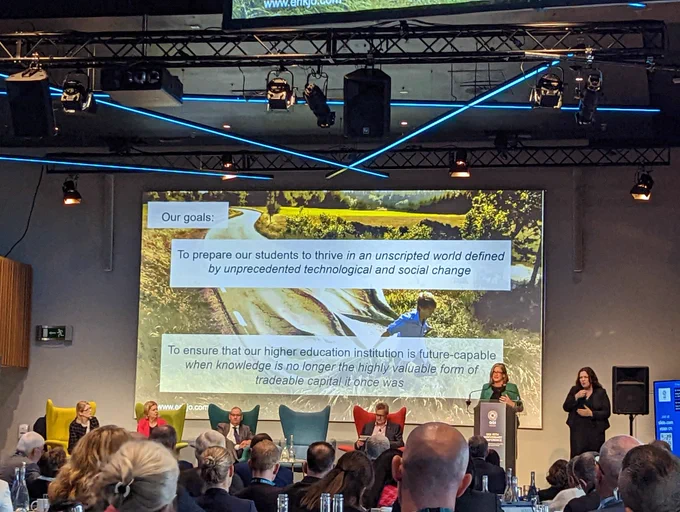Picture showing a tarmac road turning into a piece of fabric, covering a field of wheat.
Quotes overlayed suggesting knowledge required to thrive is changing