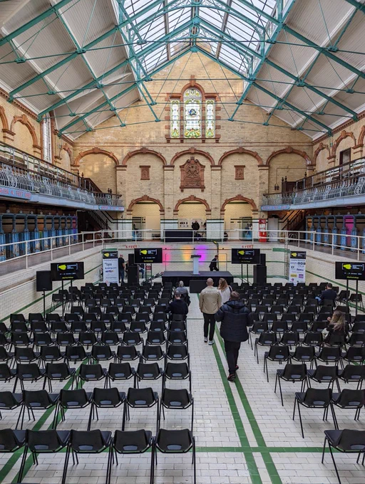 A stage and seats in a restored Victorian swimming pool