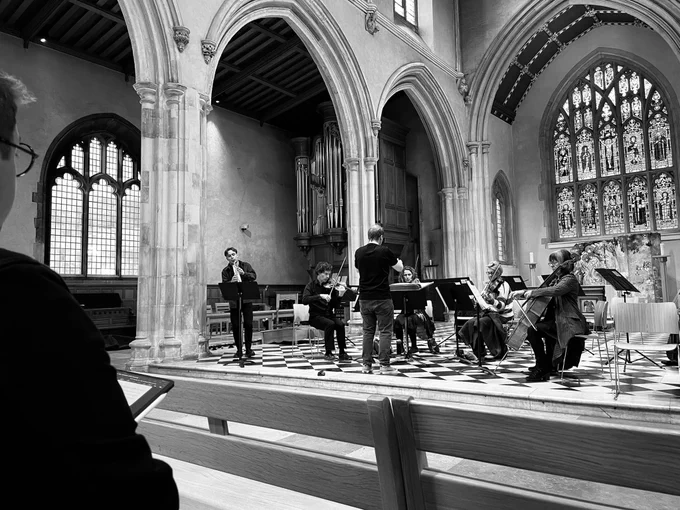 Musicians perform in a church 