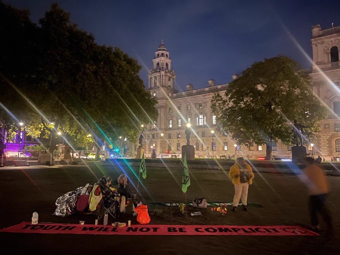 Overnight vigil in Parliament Square keeping watch over an oak sapling planted by XR Youth