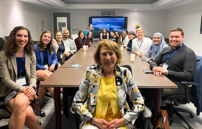 Members of the Youth Council with Chief Science Advisor Dr. Mona Nemer at a conference table.