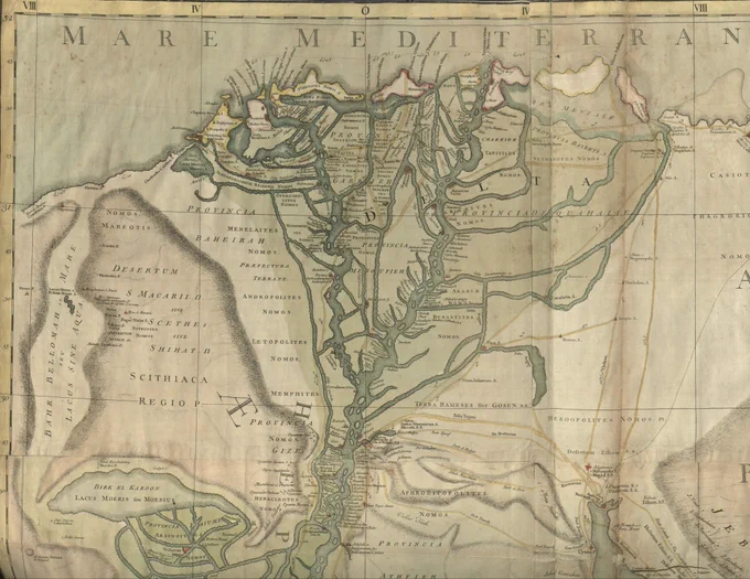 Image of a portion of a map of Egypt showing the Nile River Delta from Lake Moeris in the south to the Mediterranean Sea, with the River colored dark green and the Lake and Sea a lighter green.