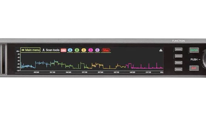 Photo of the front panel of Shure AD600 Spectrum Manager with an RF scan on the home screen.