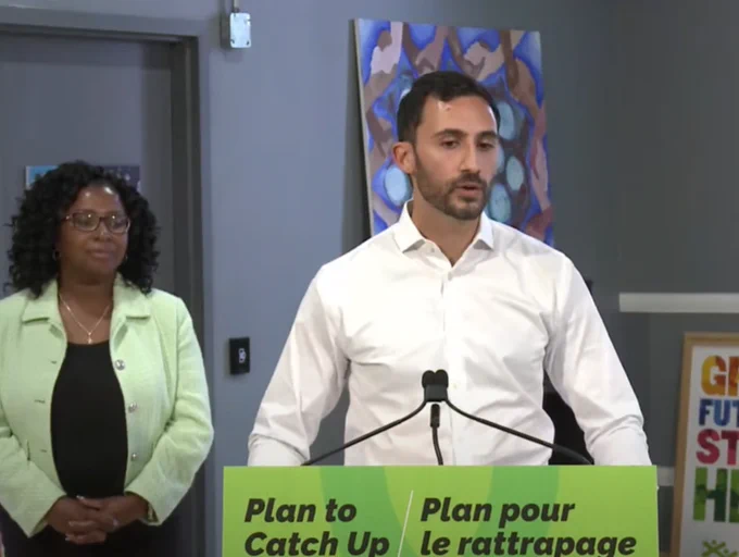 Lecce speaking at podium