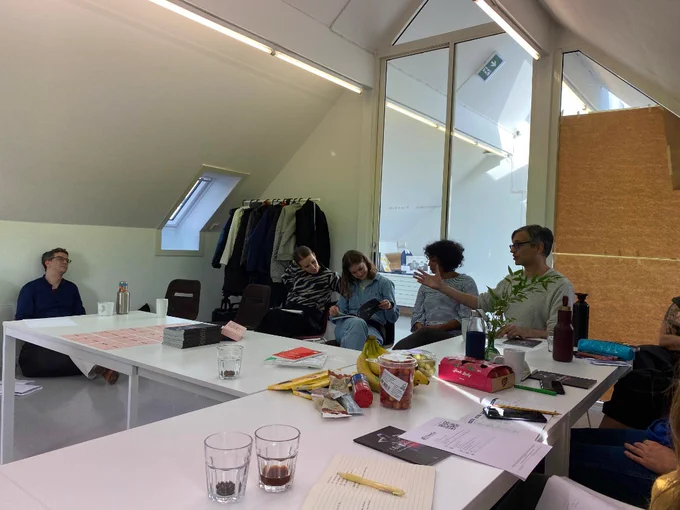 Springback writers sitting at a table and chatting