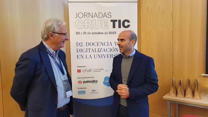 Two persons discussing
