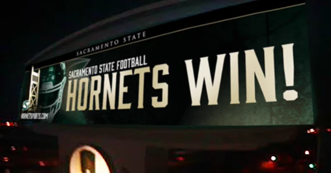 Highway 50 billboard reads, “HORNETS WIN”