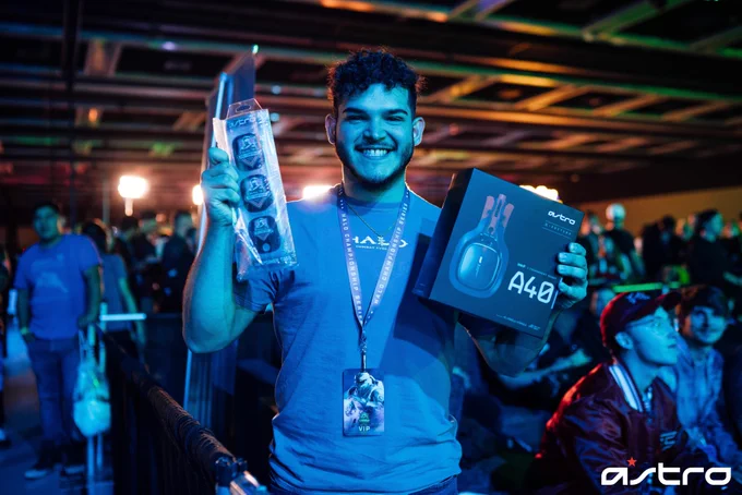 Person holding an A40 Headset and HCS speaker tags
