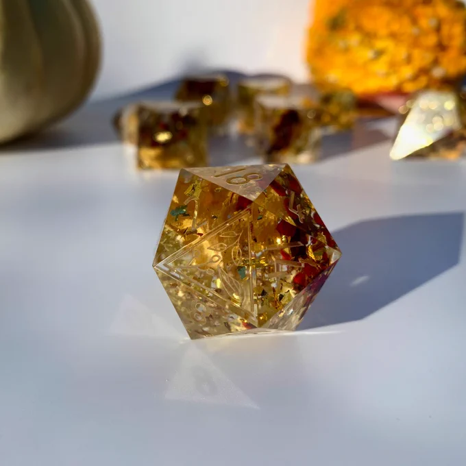 Polyhedral dice for dungeons and dragons or other ttprgs these have lichen, sumac, flower petals, and grass within