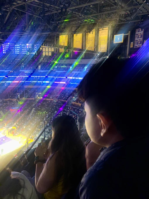 Stands at Crypto Arena during Lakers game. Championship banners in background.