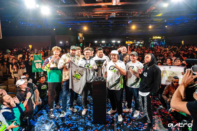 OpTic Gaming, the Champions of HCS, with a crowd surround them.