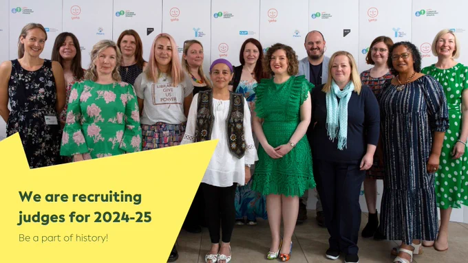 Photo of 2022 judges in front of a branded wall. Text over the photo reads 'We are recruiting judges for 2024-25. Be a part of history!'