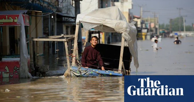 A boy at a former street stall in a flooded area of Khyber Pakhtunkhwa province, Pakistan, in August.