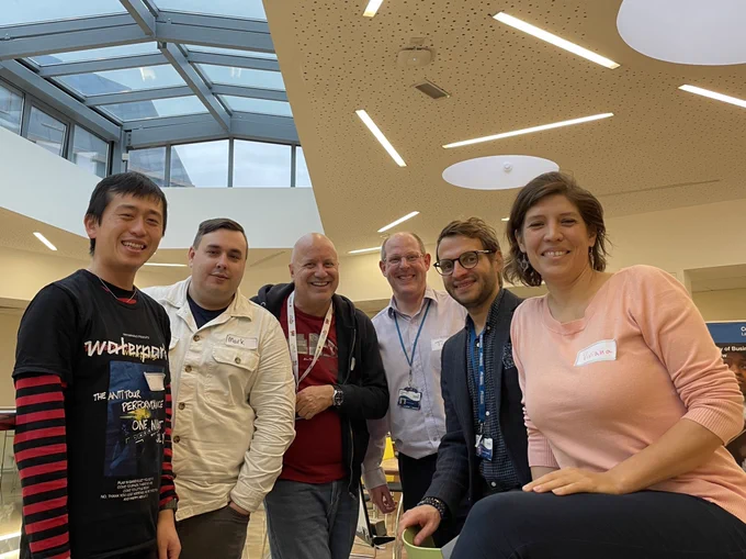 Six people from the organising team of the Coventry Cultural Challenge pose for a photo at Coventry University