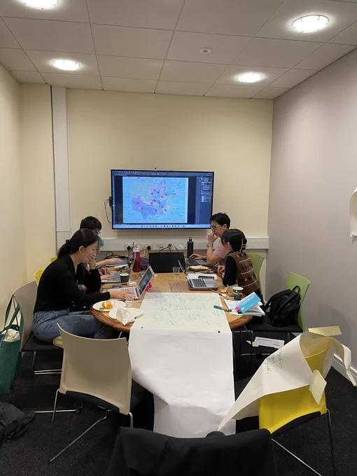 Team working hard with a map of the City in the background