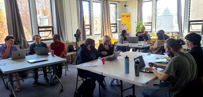 People working together in a Coderetreat at Code & Supply Workspace Presentation Room
