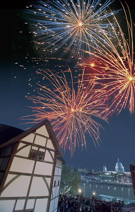 Colourful fireworks explode and light up the night sky over the Globe Theatre and River Thames.