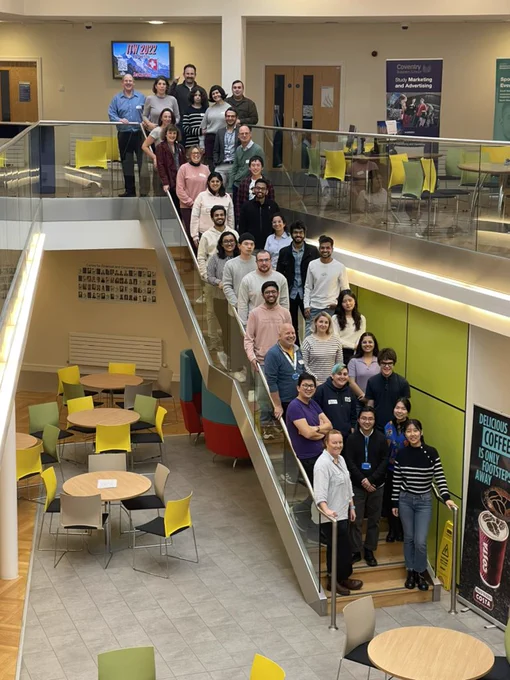 Challengers standing on the staircase at Coventry University Jaguar Building