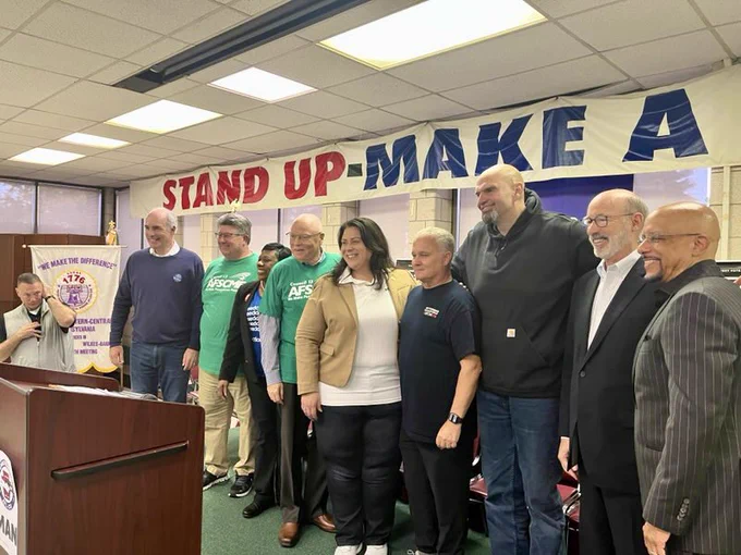 Several PA lawmakers and union leaders pose for a picture.