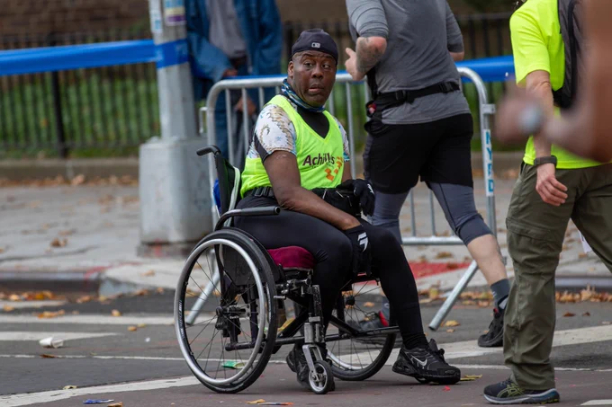 Dave Fraser in a wheelchair competing in the NYC Marathon. Photo by Sam Rubin.