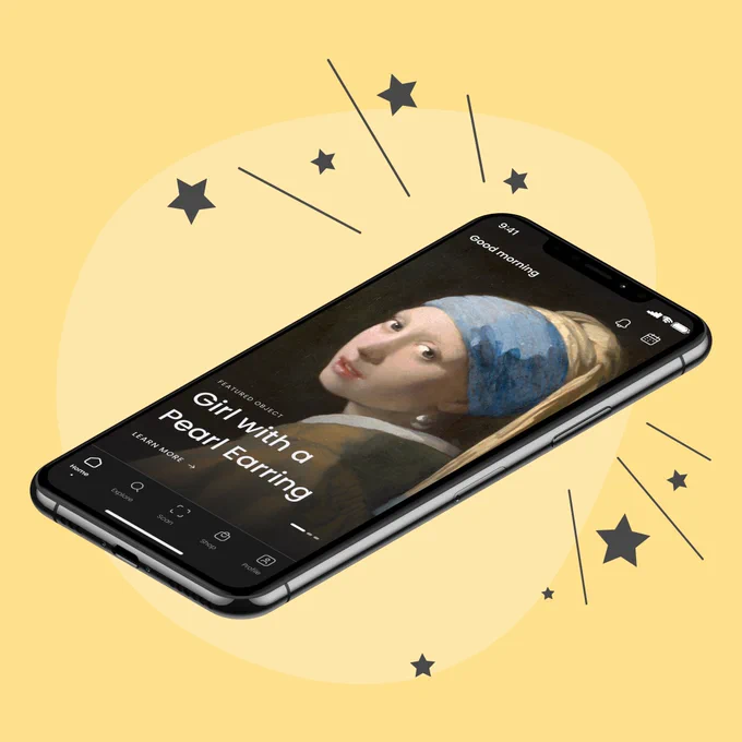 A mobile phone showing the home screen of the new Smartify app. On the screen is a painting of a girl with a pearl earring, wearing a blue headdress and staring straight at us.