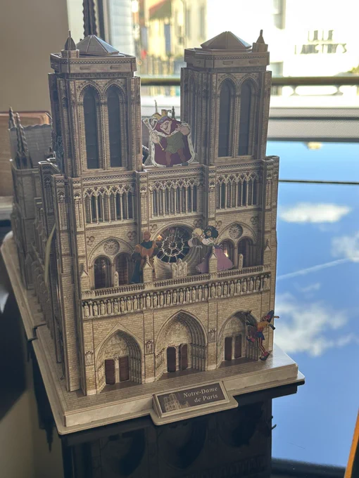 A model of Notre Dame. With the Disney character placed upon it