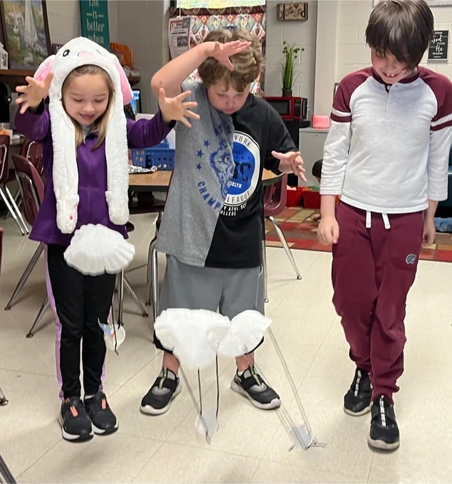 Students test their parachutes and landing pods  