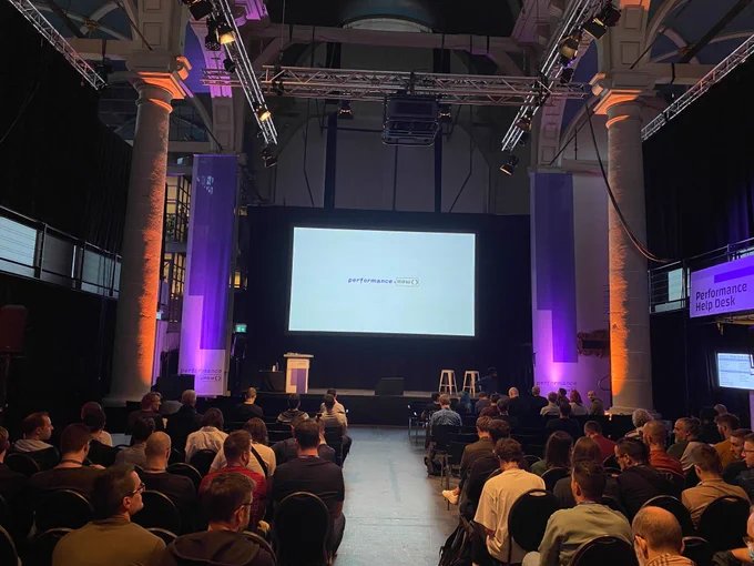 People sitting in front of the stage at perfnow conference.