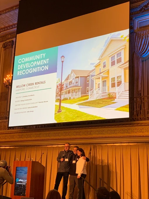 The Willow Creek Rentals project team on stage at the 2022 Phius Passive Projects Design Competition awards ceremony.