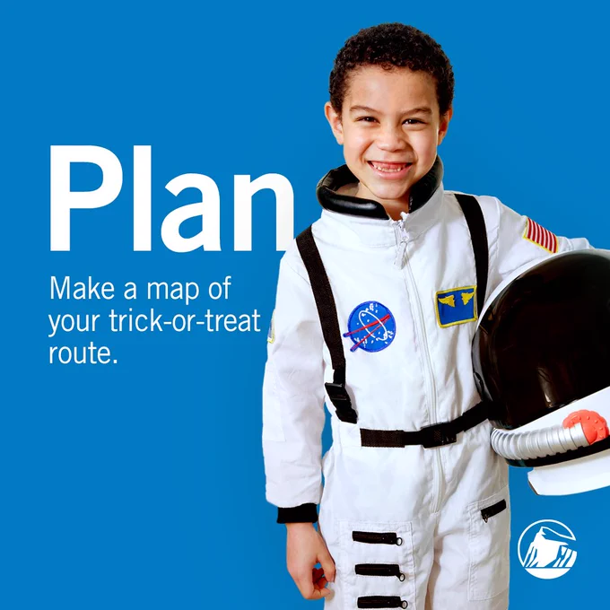 Boy in astronaut costume. Plan. Make a map of your trick or treat route.