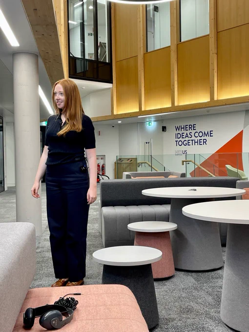 Ava stood in the atrium of the Nexus building at the University of Leeds about to start filming apiece about her company, Perfect Sense AQ Ltd.
