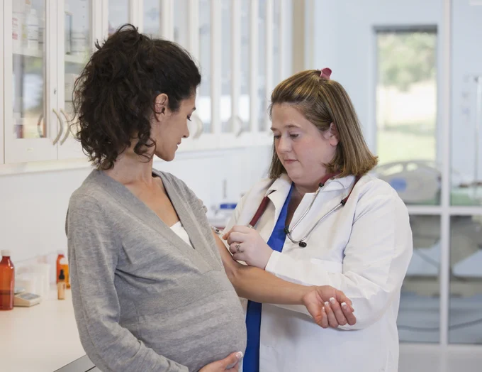 Image contains: Clothing, Apparel, Sleeve, Person, Human, Long Sleeve, Lab Coat, Coat