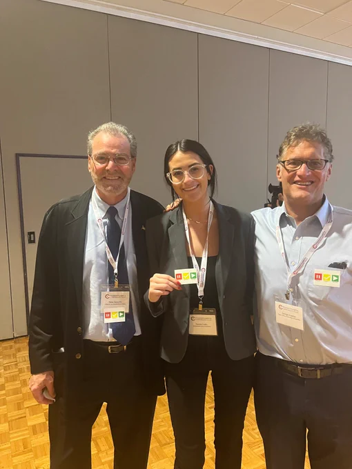 Members of the Statewide Risk Management Team wearing their Pause Verify Report stickers at the Massachusetts Cybersecurity Forum