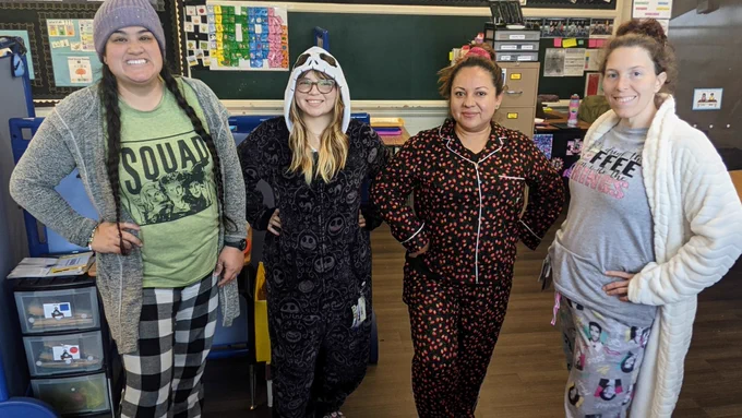 4 teachers in a row wearing the coziest pajamas! All with their hands on their hips, smiling because it's the weekend!