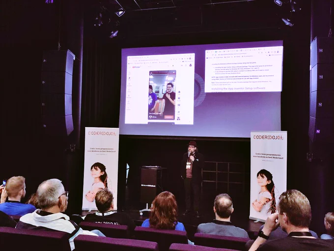 Bill Liao on stage giving a keynote at Dojocon 
