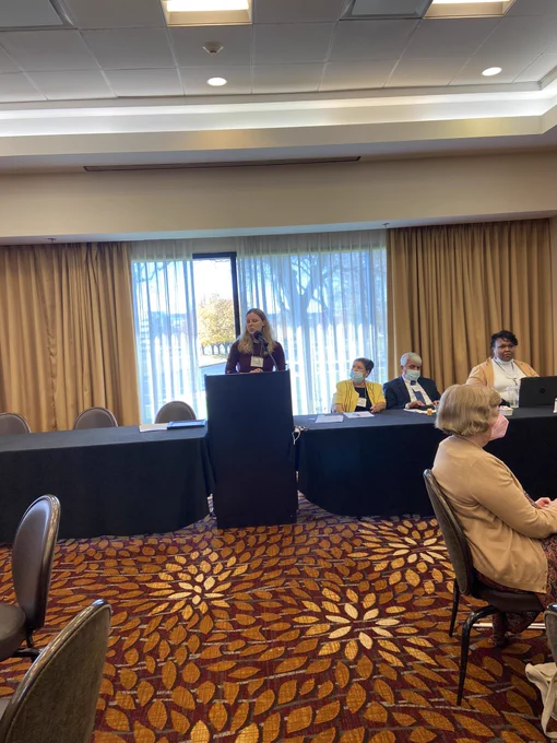 Elizabeth Stans at  the podium