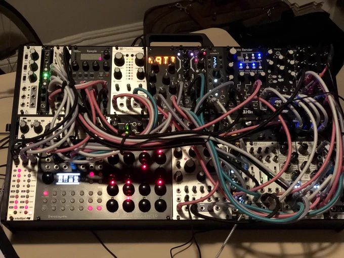 a modular synthesizer, all patched up and ready to scream